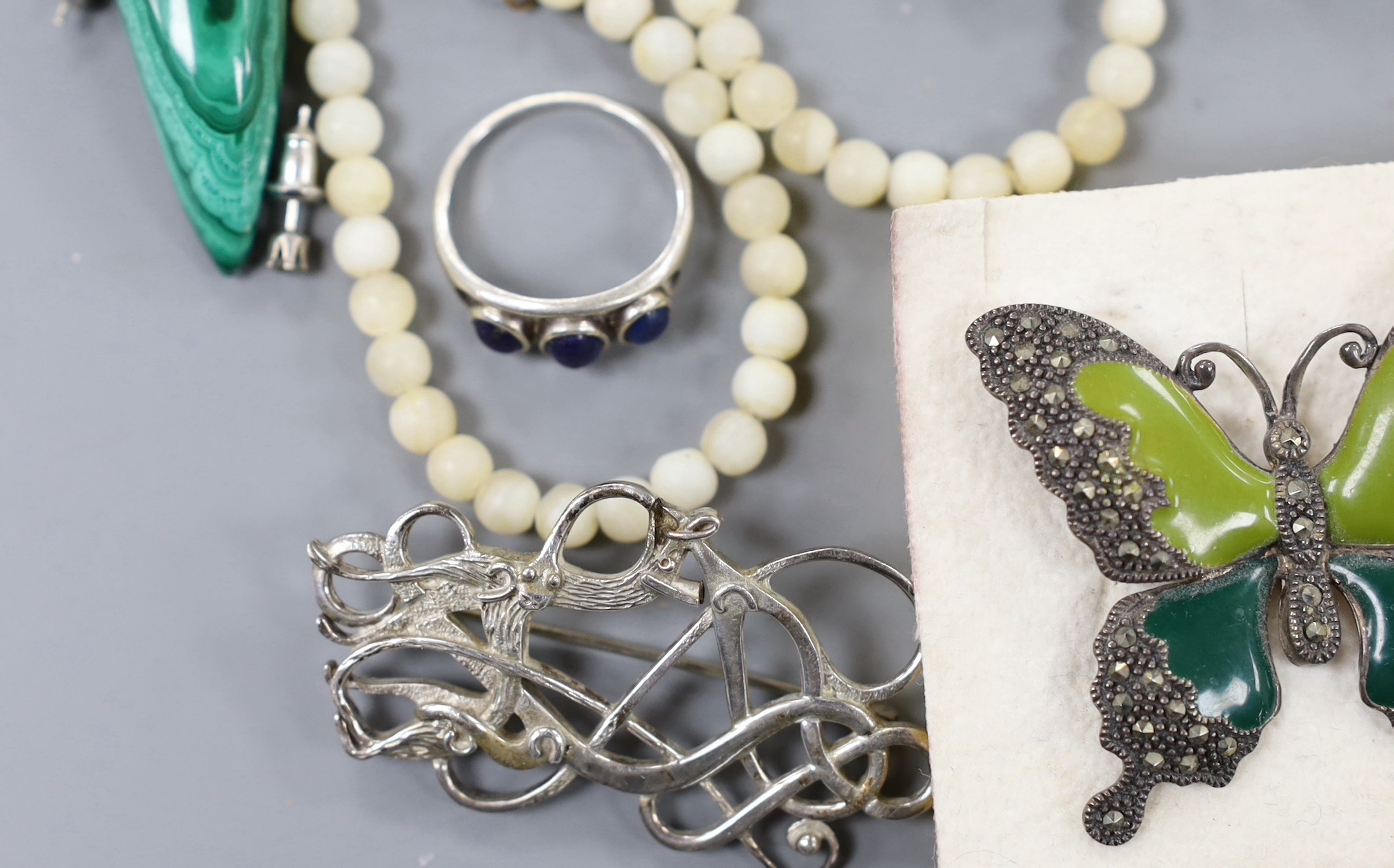 Assorted jewellery including cultured pearl necklace, jadeite bead necklace, marcasite set butterfly brooch, pair of carved coral earrings etc.